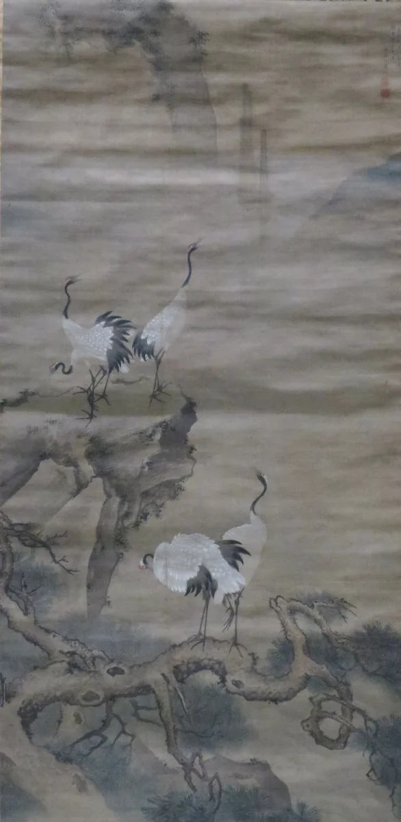 Chinese hanging-scroll painting of cranes and pines among the peaks of the Kunlun mountains.