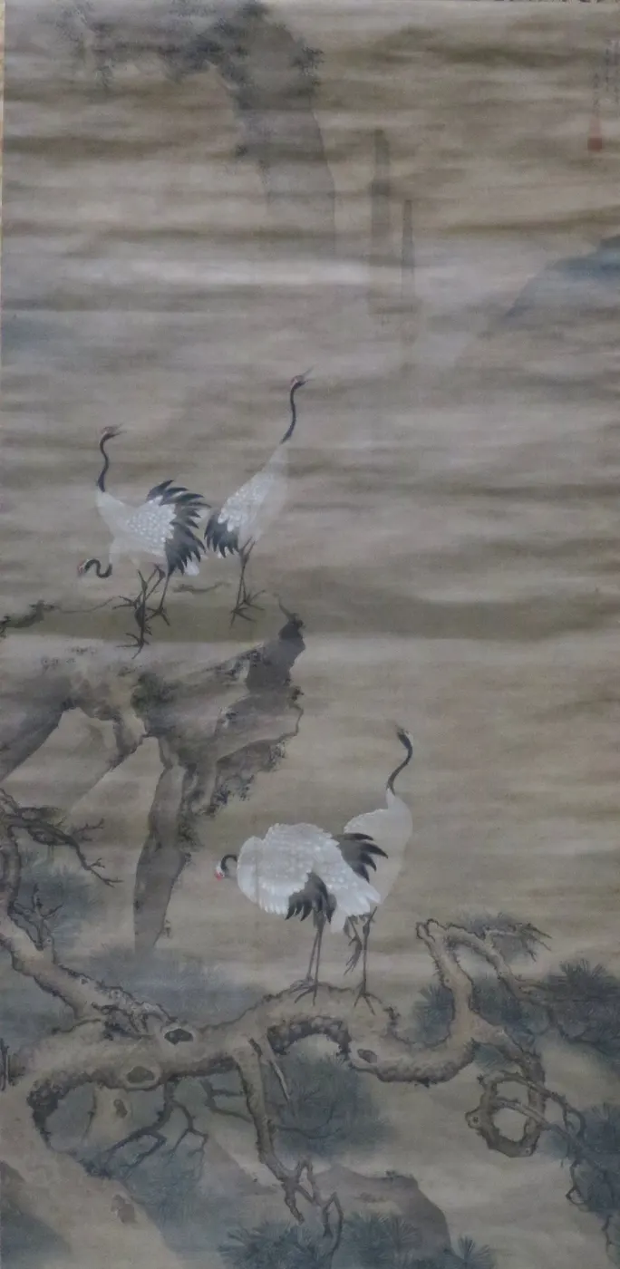 Chinese hanging-scroll painting of cranes and pines among the peaks of the Kunlun mountains.