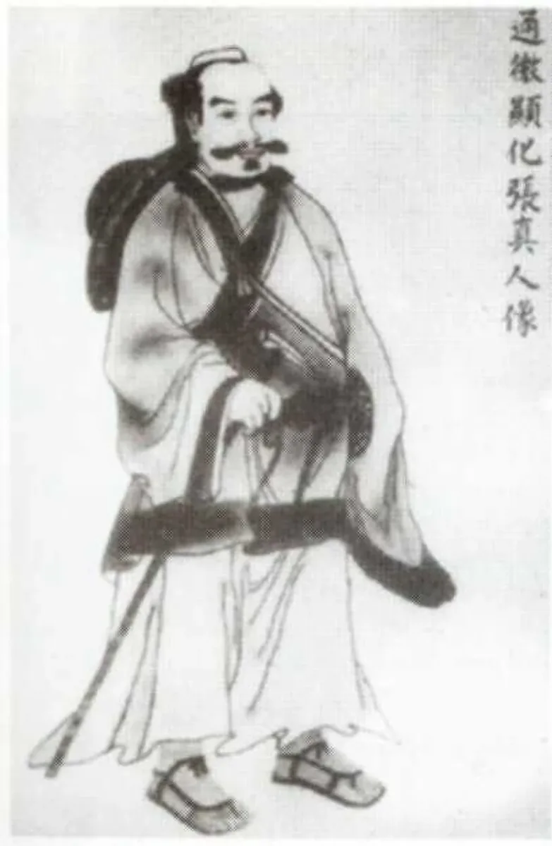 Traditional ink portrait of Zhang Sanfeng, a bearded Taoist in robes carrying a staff.