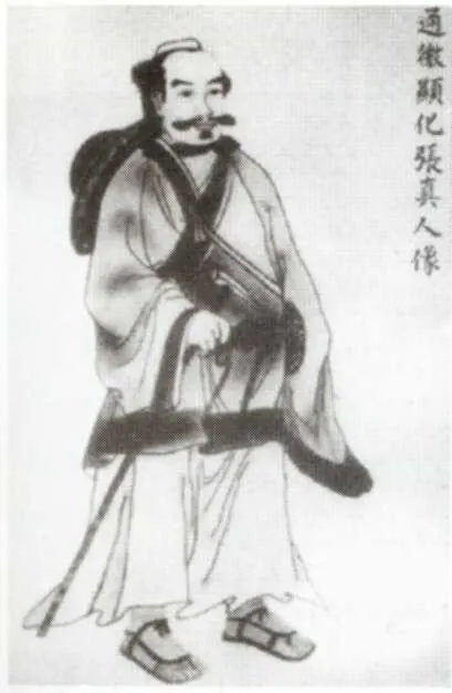 Traditional ink portrait of Zhang Sanfeng, a bearded Taoist in robes carrying a staff.